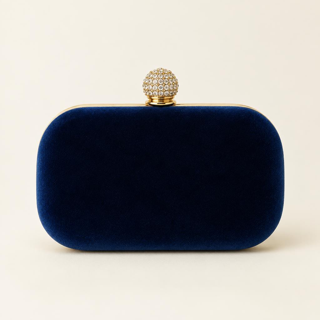Navy velvet minaudière with a crystal ball clasp